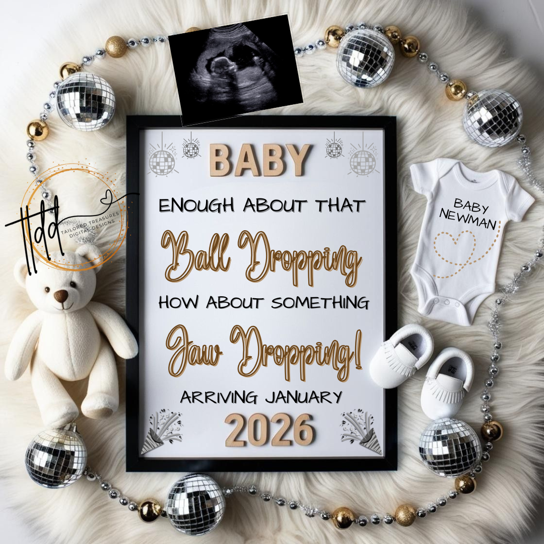 Framed pregnancy announcement new years sign with baby items on a textured surface